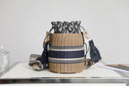 BUCKET BAG 19 IN BLACK OBLIQUE JACQUARD AND BEIGE WICKER