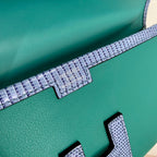 JIGE ELAN 29 CLUTCH IN TEAL GREEN CALFSKIN WITH ROYAL BLUE LIZARD SKIN
