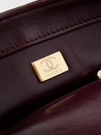 CHANEL FLAP BAG WITH TOP HANDLE 18 IN WINE RED OIL-WAX LAMBSKIN GOLD HARDWARE