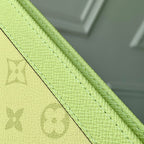 POCHETTE VOYAGE 26 IN LEMON YELLOW MONOGRAM ECLIPSE CALFSKIN