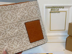 LOE 28 CLUTCH BAG IN BEIGE ANAGRAM JACQUARD
