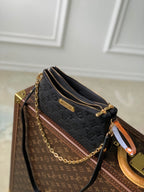 LIV POCHETTE BAG 24 IN BLACK MONOGRAM EMPREINTE LEATHER