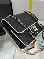 CHANEL QUILTED FLAP BAG WITH WHITE TRIM 19 IN BLACK LAMBSKIN