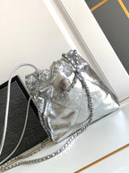 CHANEL 22 BAG IN SILVER SHINY CALFSKIN AND GOLD METAL